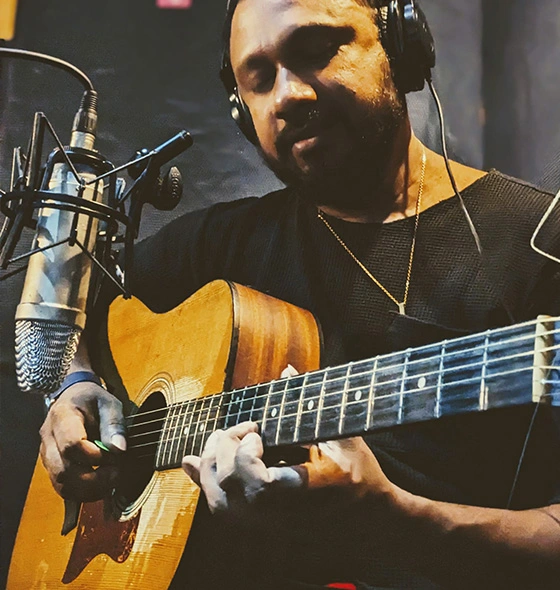 Talented guitarist Shan Niro playing and recording at the studio.